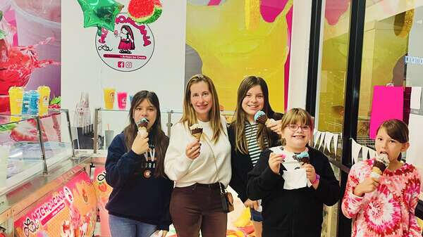 Family who ordered Ice cream Family who ordered Ice cream cones at La Michoacana de Tocumbo in Santa Fe Springs